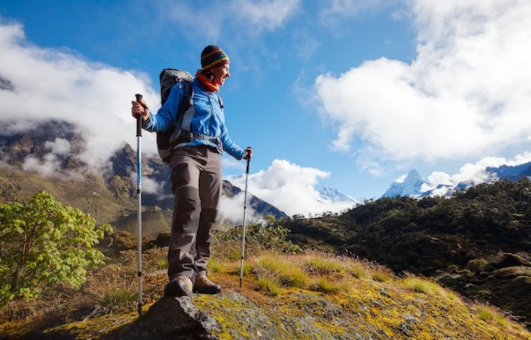 Hiker engaging on a multi-day hike through the Himalayas in Nepal