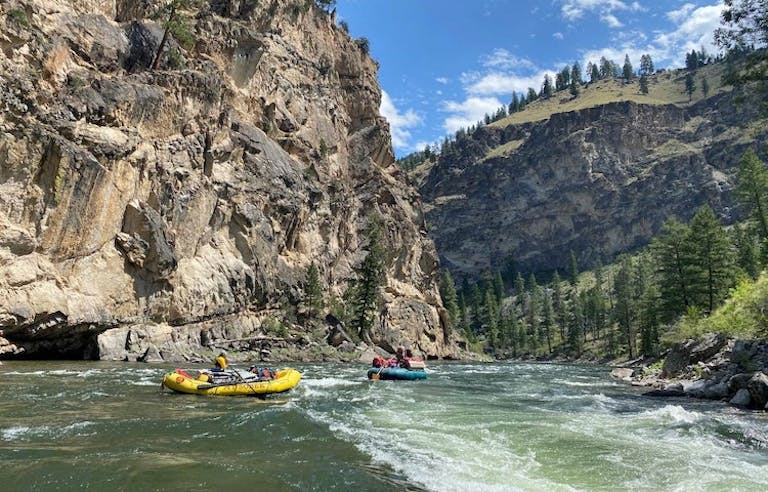 Boats of tourists rafting on the mighty rapids of the Middle Fork