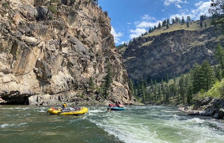 Boats of tourists rafting on the mighty rapids of the Middle Fork