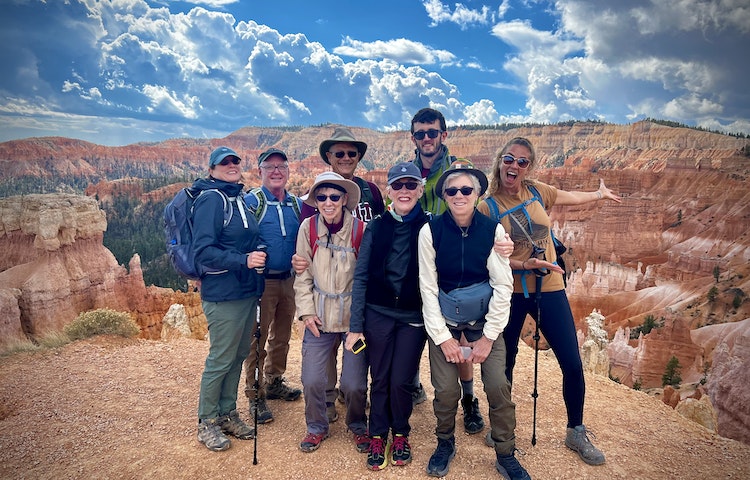 A group of people posing for a photo in bryce canyon.