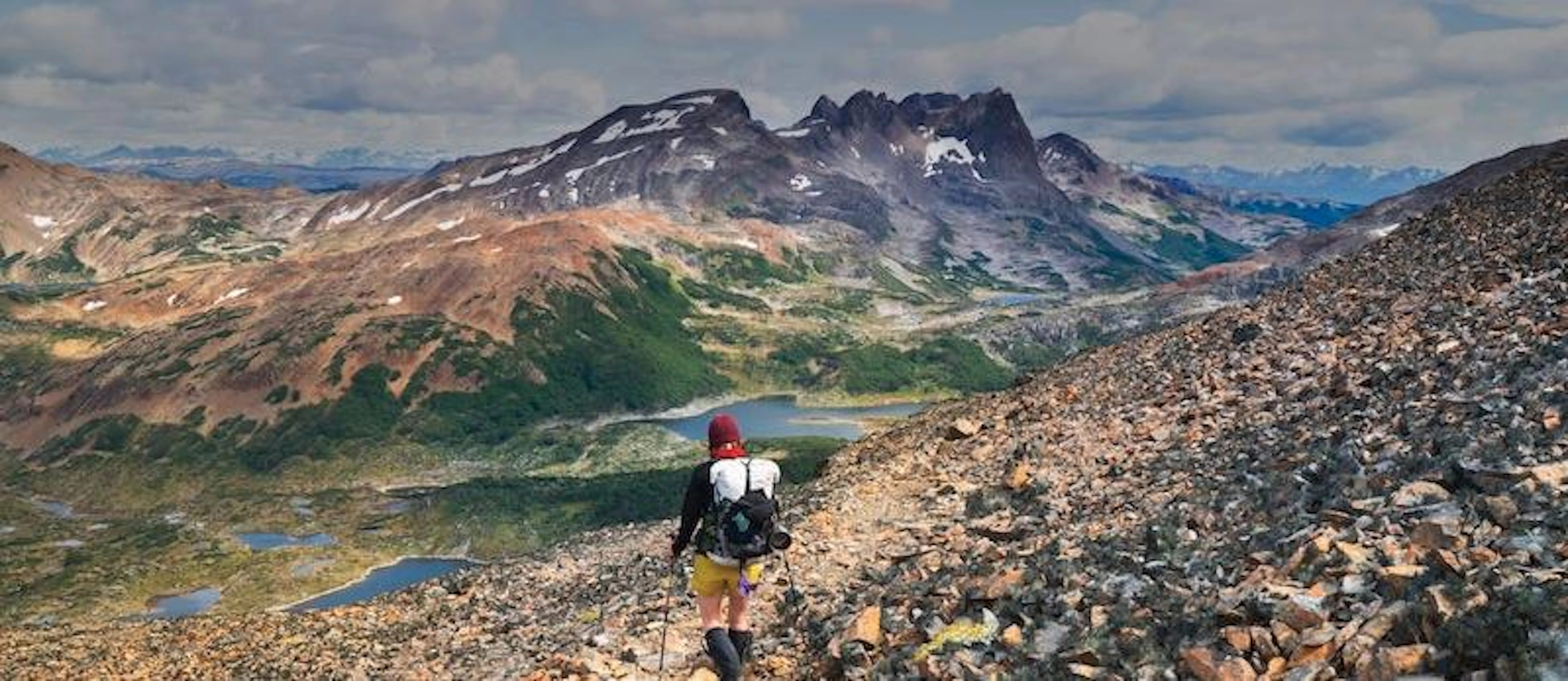A person hiking up one of the best rocky mountain trails in Chile.