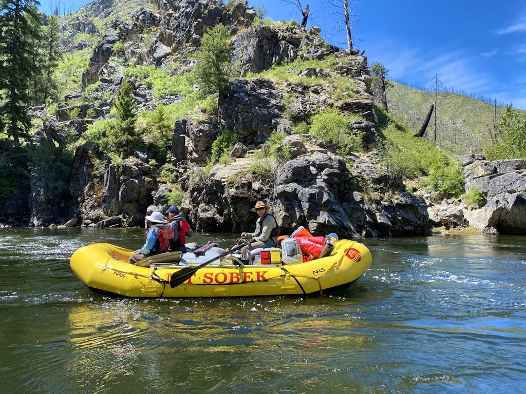 Yellow MT Sobek rafters in the middle of the Middle Fork of the Salmon River in Idaho