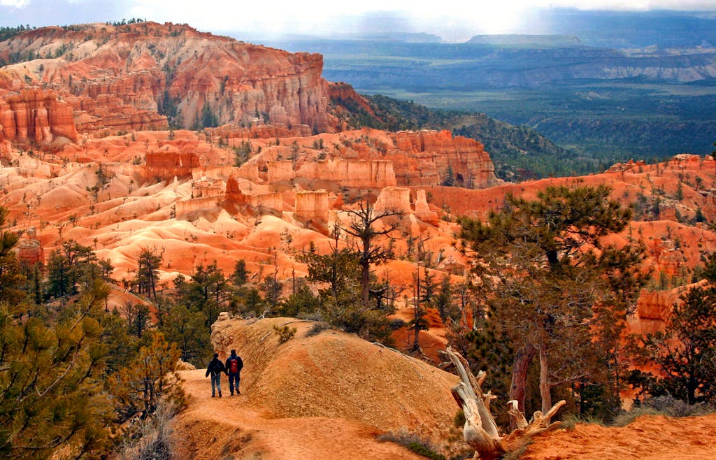 hikers head down a trail to the interior of Bryce Canyon National Park in southwestern Utah 