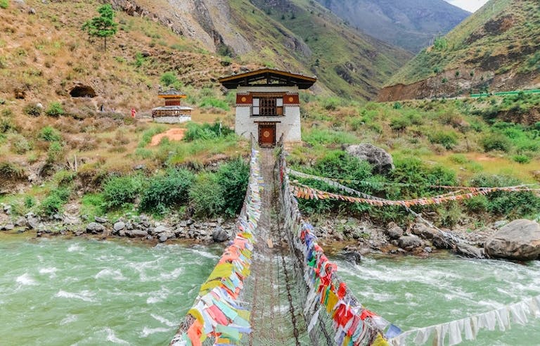 Tourists going on a suspension bridge in Nepal