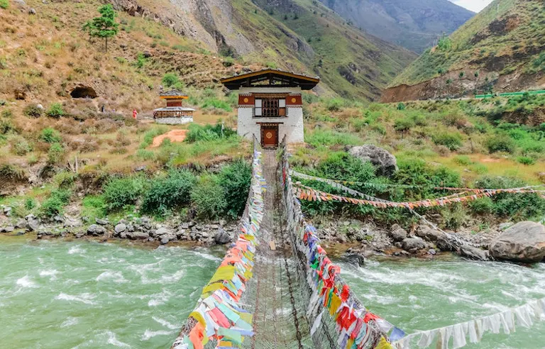 Tourists going on a suspension bridge in Nepal
