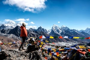 Woman standing on top of Gokyo Ri with view on Mt. Everest, Himalayas, Nepal
