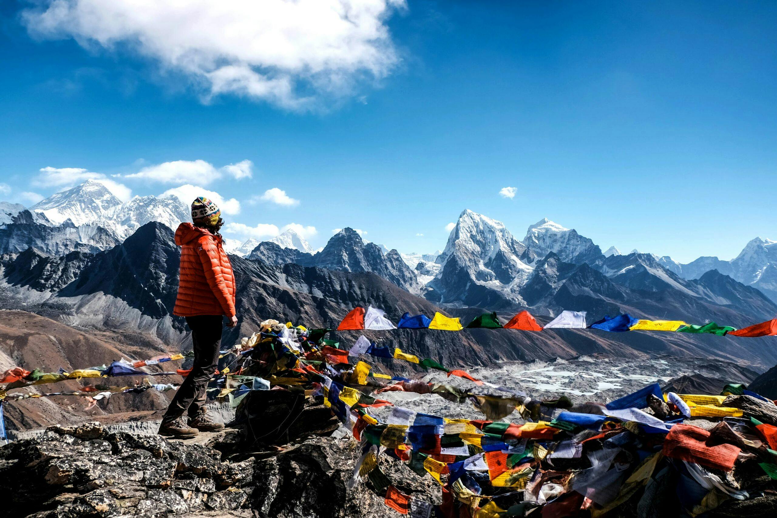 Woman standing on top of Gokyo Ri with view on Mt. Everest, Himalayas, Nepal