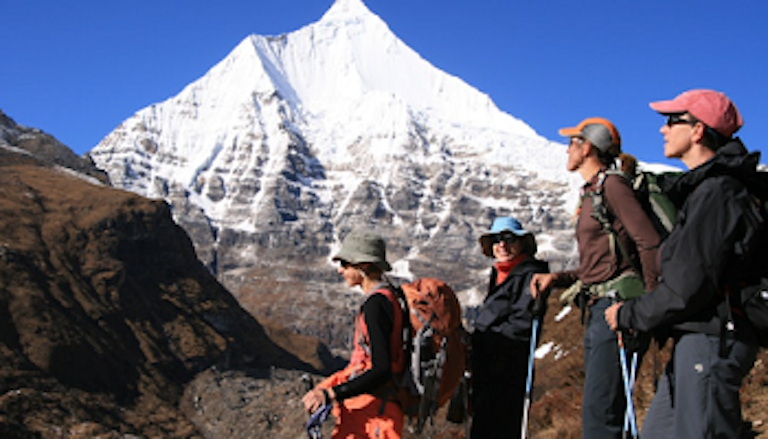 Large guided tourists in sacred Chomolhari in the Himalayas in Bhutan