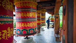 Tibetan prayer wheels in Kathmandu, Nepal, a popular destination for Bhutan travel enthusiasts.