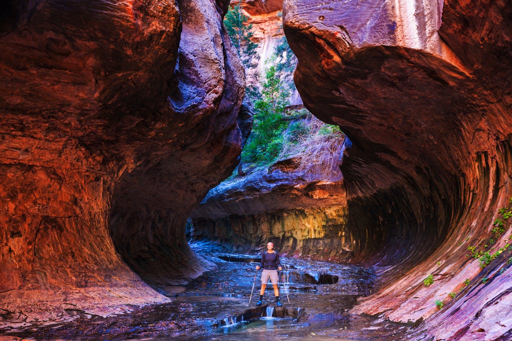 Tourist exploring the Narrows in Zion National Park in Utah, USA
