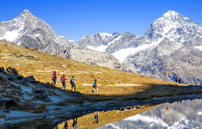 Group of hikers near Europe's highest and most iconic peak with MT Sobek