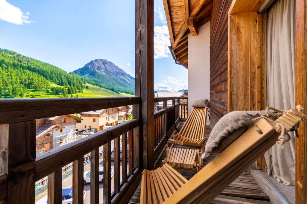Relaxing leisurely in a lounge chair in an Alps ski lodge, called Le Chalet Blanc