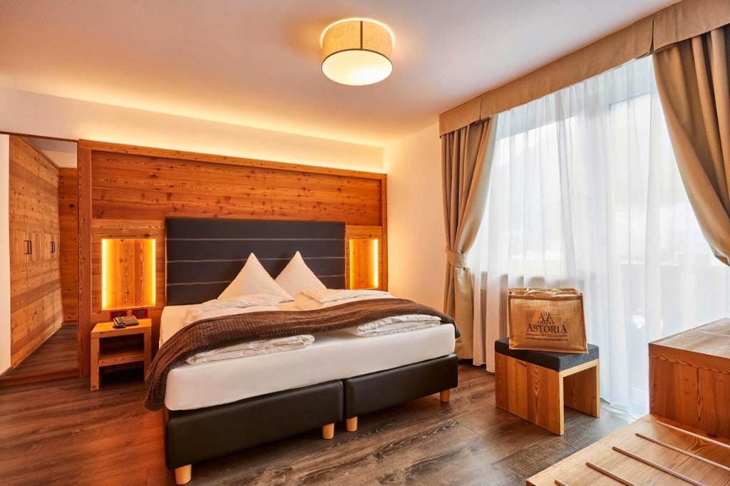 Bed is made in Hotel Astoria for tourists seeking an overnight stay