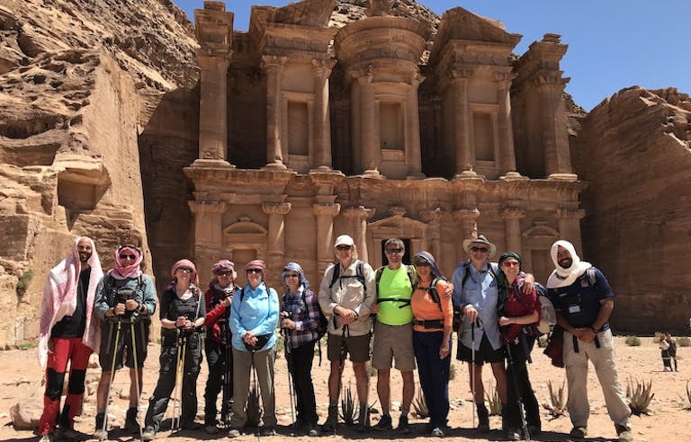 group of travelers on guided cultural discovery immersion in UNESCO-designated Petra in the Jordan in Middle East
