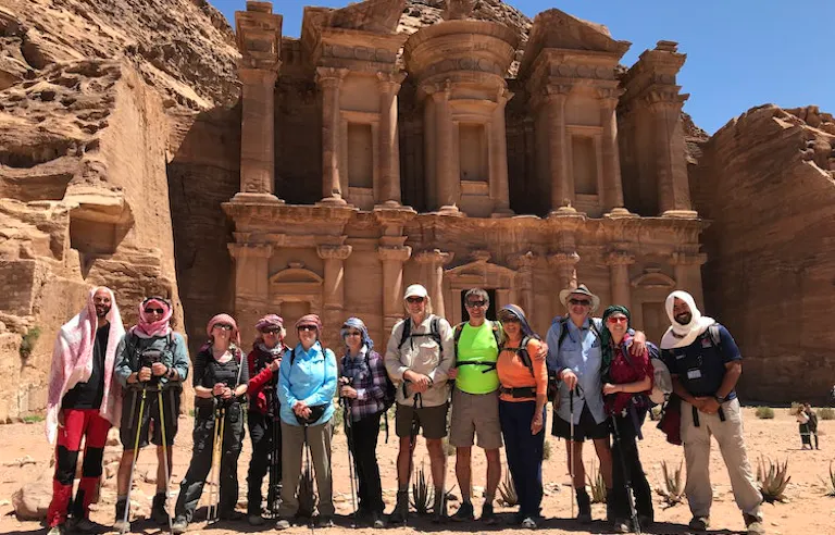 group of travelers on guided cultural discovery immersion in UNESCO-designated Petra in the Jordan in Middle East