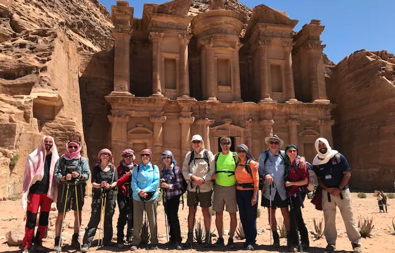 group of travelers on guided cultural discovery immersion in UNESCO-designated Petra in the Jordan in Middle East