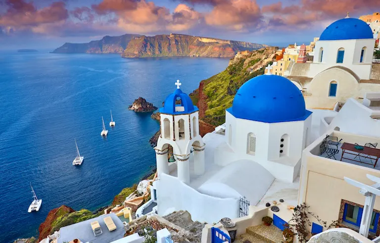 boats sailing around the romantic island of Santorini in Greece, Europe