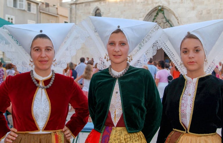 local women in traditional clothes in village in Croatia