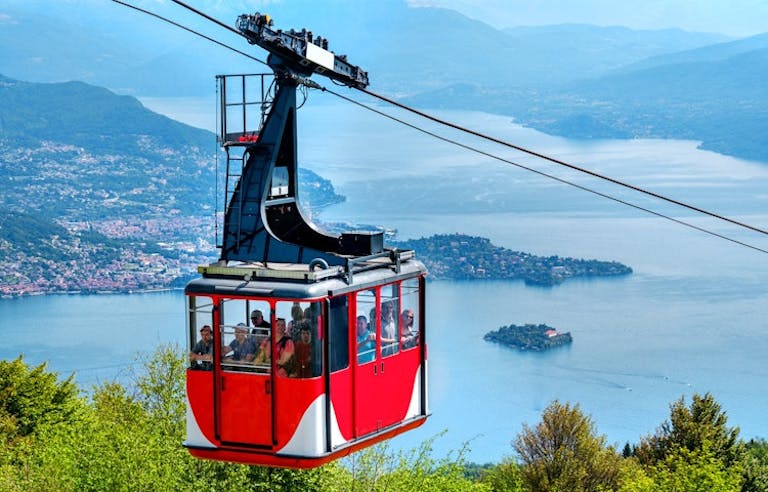 cable car ride in the Lake District area in Italy with a good bird's eye view of the turquoise waters and lakefront towns 