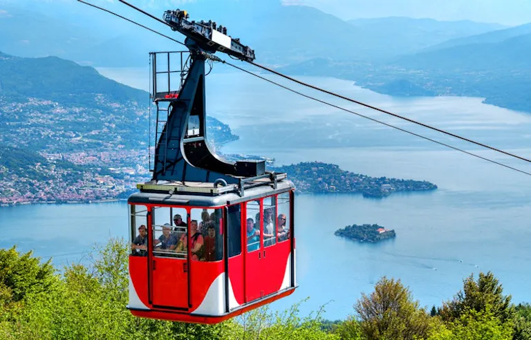 cable car ride in the Lake District area in Italy with a good bird's eye view of the turquoise waters and lakefront towns
