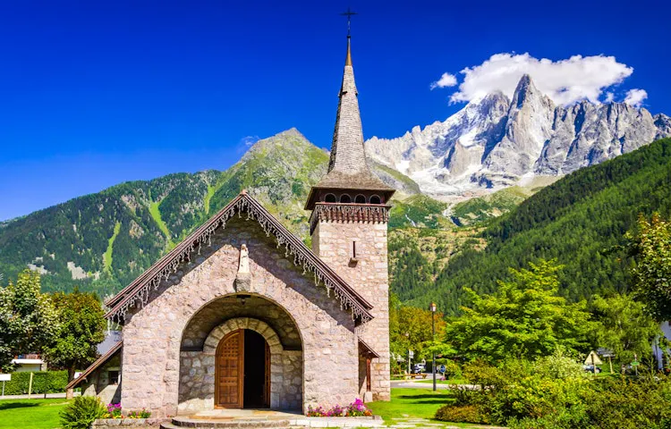 View of a church and mountains in the Alps, Europe