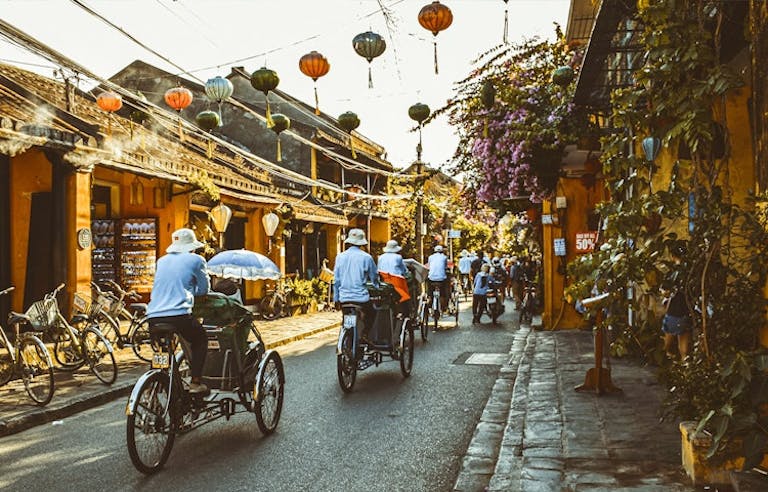 local villagers on bikes in Hanoi 