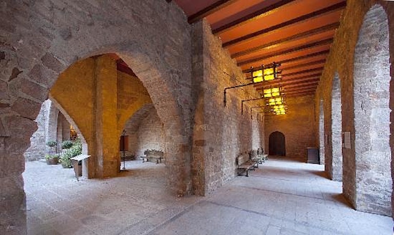 Tourists stay overnight at Parador de Cardona during their guided tour in  Spain