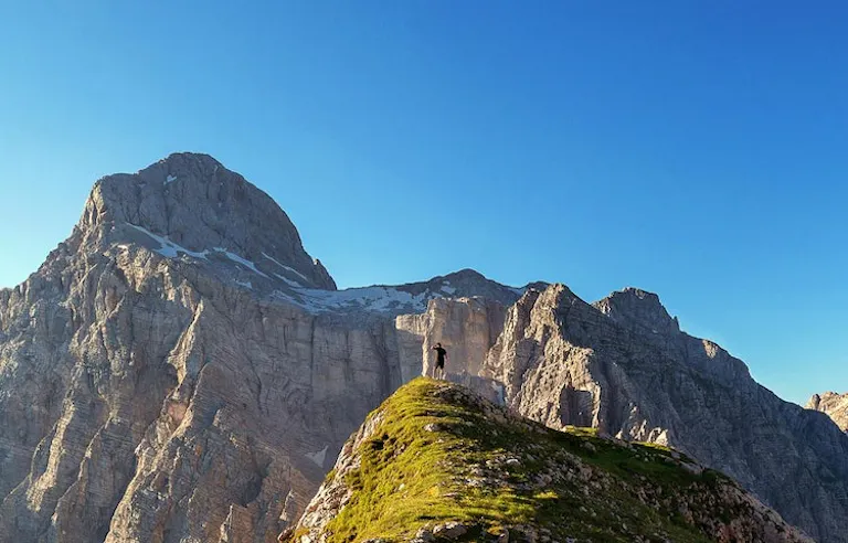 solo male traveler at the top of the Dinaric Alps in the Balkans in Europe