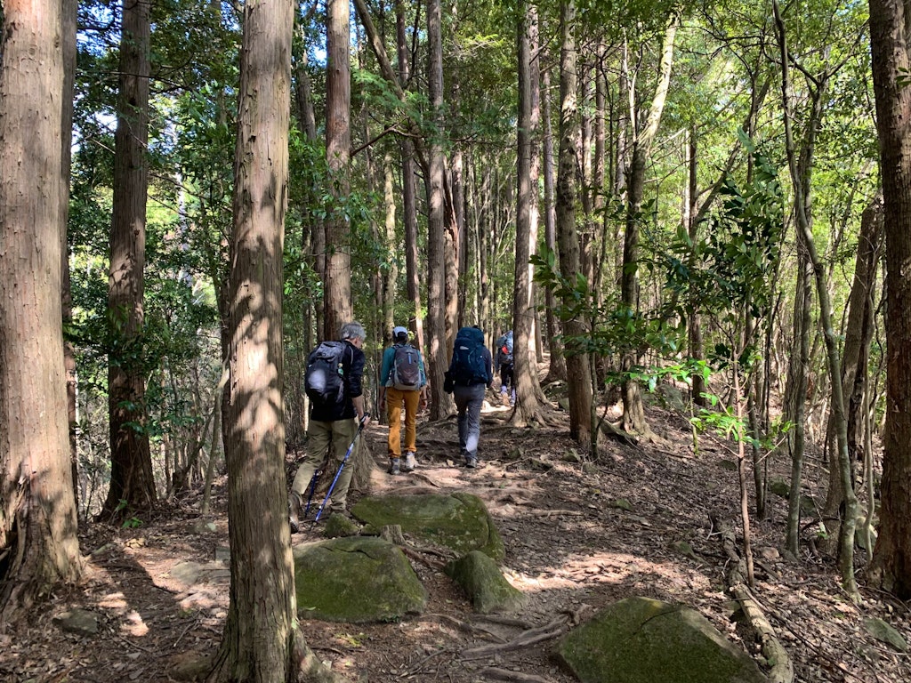 Travelers embarking on the Kumano Kodo Ancient Pilgrimage Route from the starting point of the Nakahechi Route