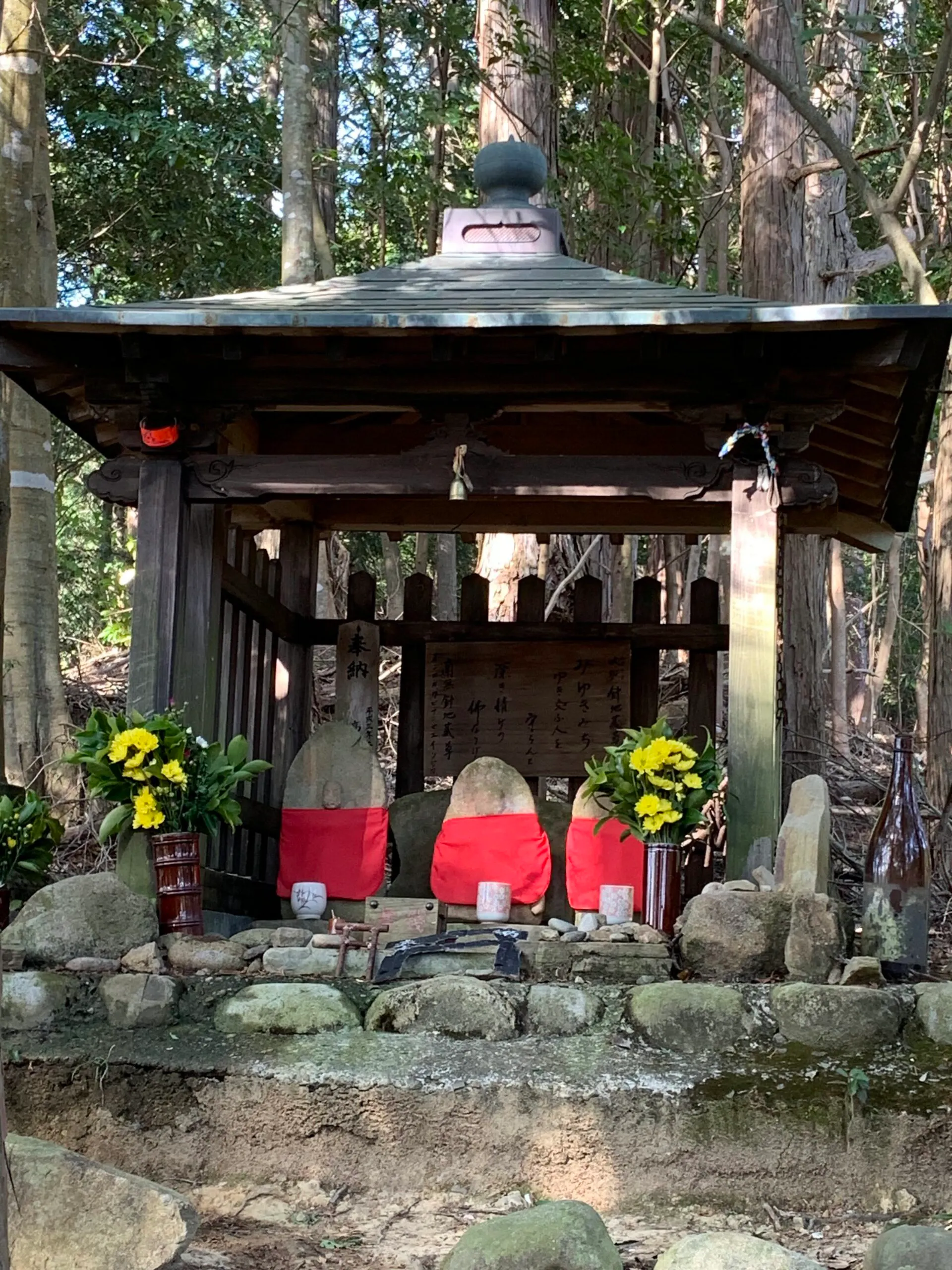 A small shrine in a wooded area.