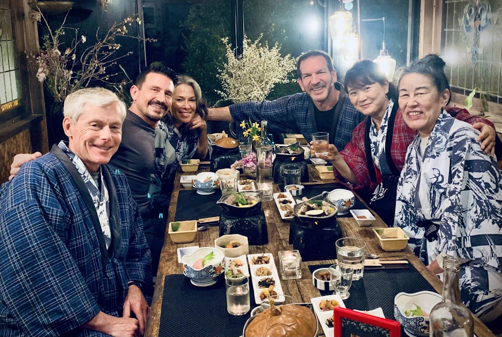 Group of travelers enjoying a gourmet Japanese meal along the Kumano Kodo trail