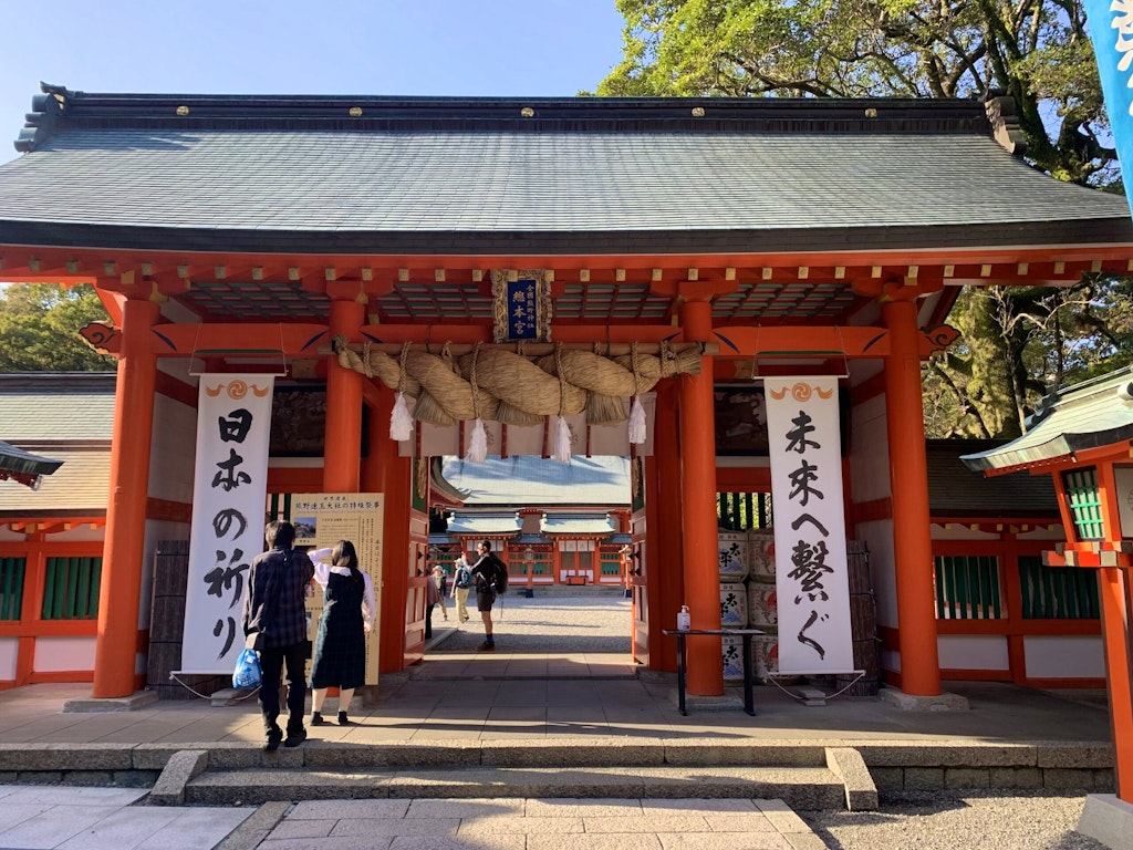 Group of tourists exploring the popular tourist landmark the Hongu Taisha Temple along the Kumano Kodo Trail