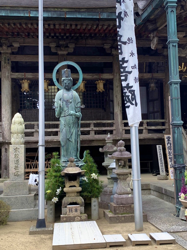 Travelers exploring the Oji Shrines that is adorned with Yamabushi mountain gods