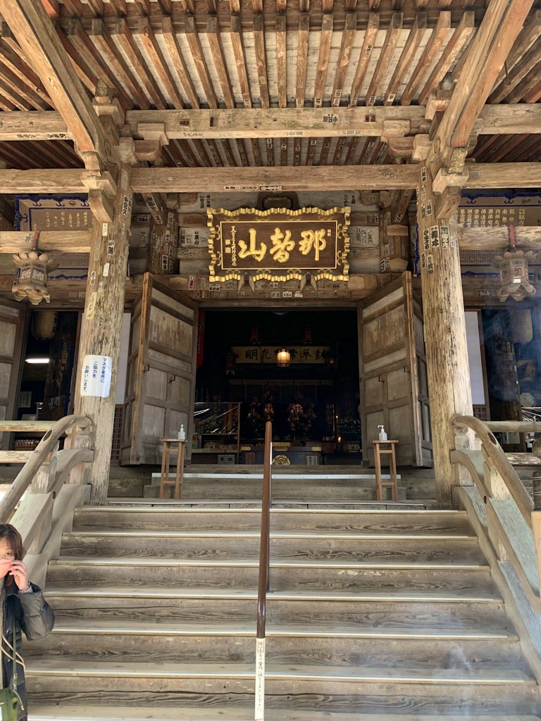 Travelers do traditional worship rituals at Oji Shrines along the Kumano Kodo - such as clapping hands, engaging in personal prayers, and washing hands