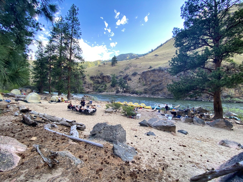 Travelers staying overnight with comfortable camping accommodations near Idaho's Middle Fork of the Salmon River