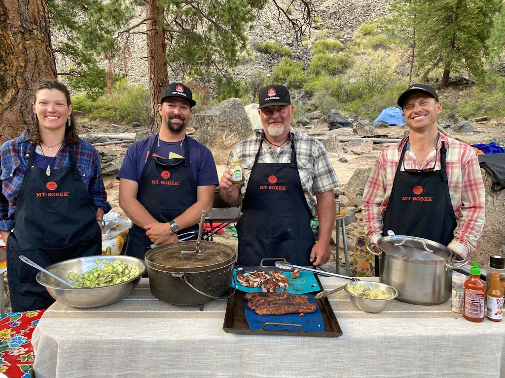 Private chefs cooking a gourmet meal along Idaho's Middle Fork of the Salmon River