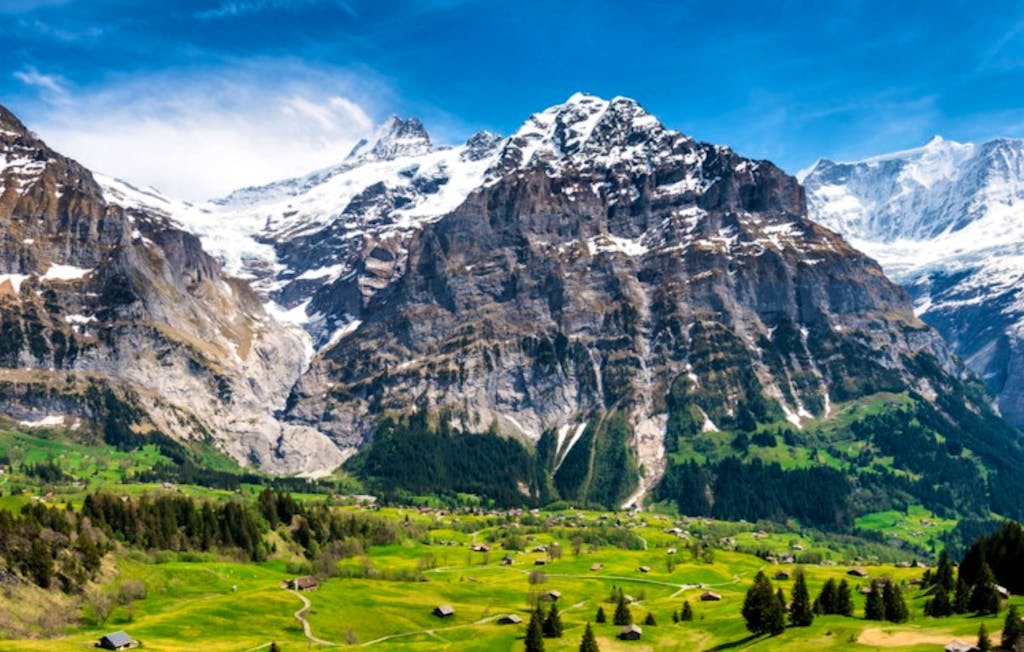 Panoramic view of the green mountain town of Grindelwald, which has an open view of the northern face of the Eiger
