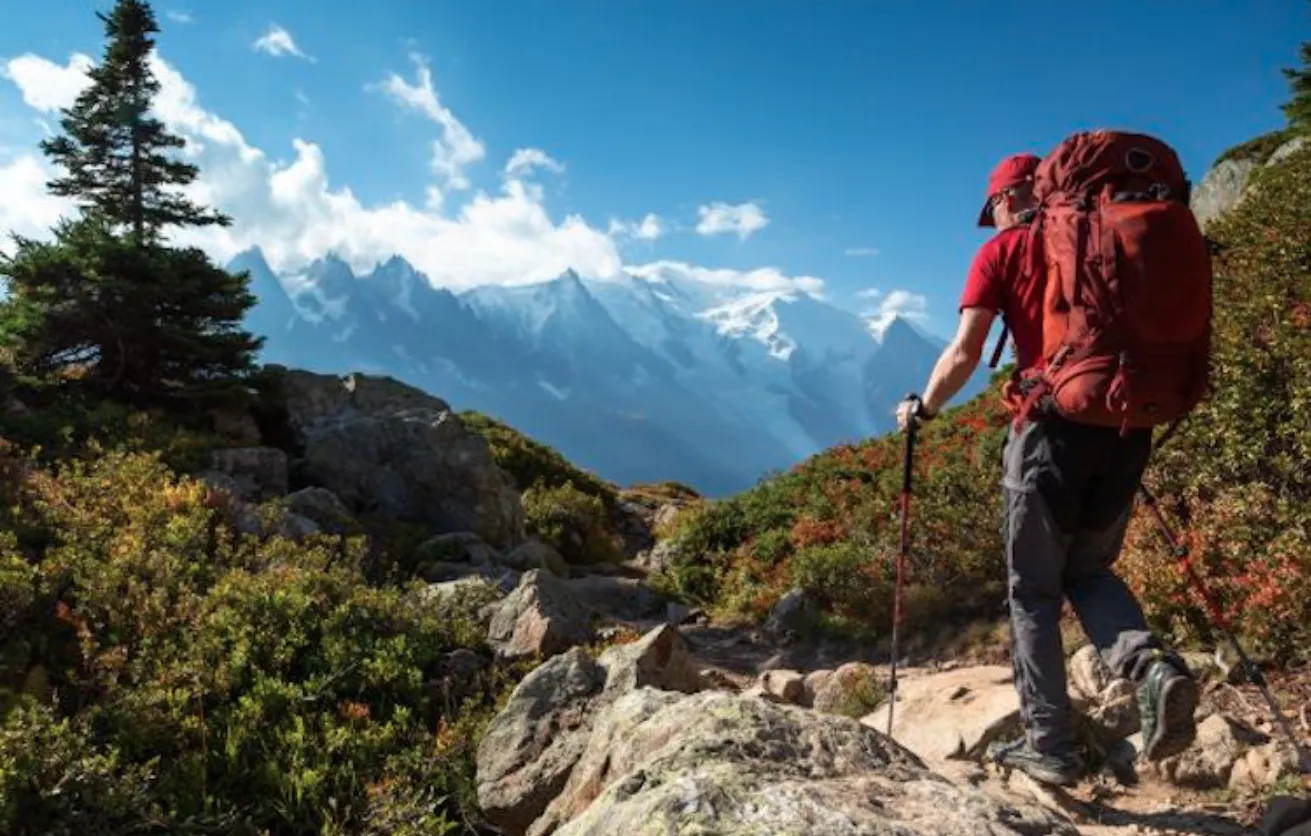 Hiker trekking on a off the beaten path trail near the Mont Blanc