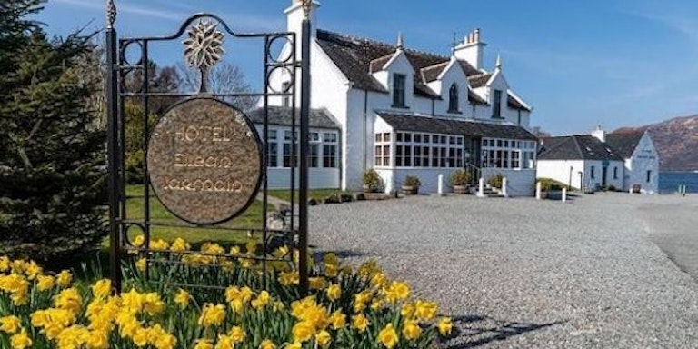 Tourists who are seeking an overnight stay at a local hotel checks out Hotel Eilean, Iarmain, Scotland, Europe