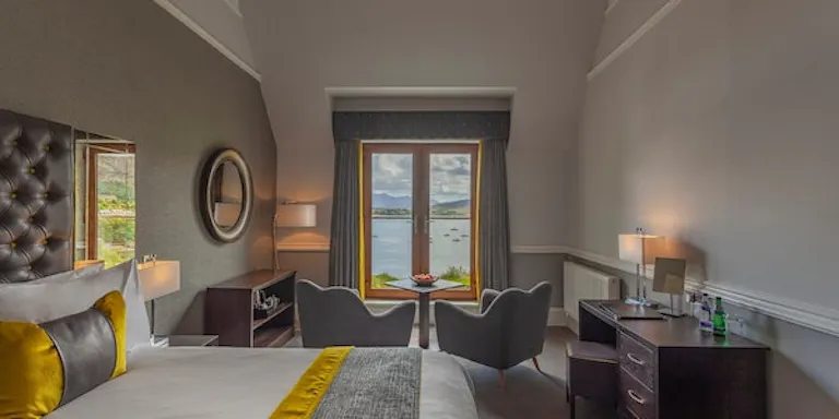Tourists who are seeking an overnight stay at a local hotel checks out Cuillin Hills Hotel in Portree-Skye, Scotland