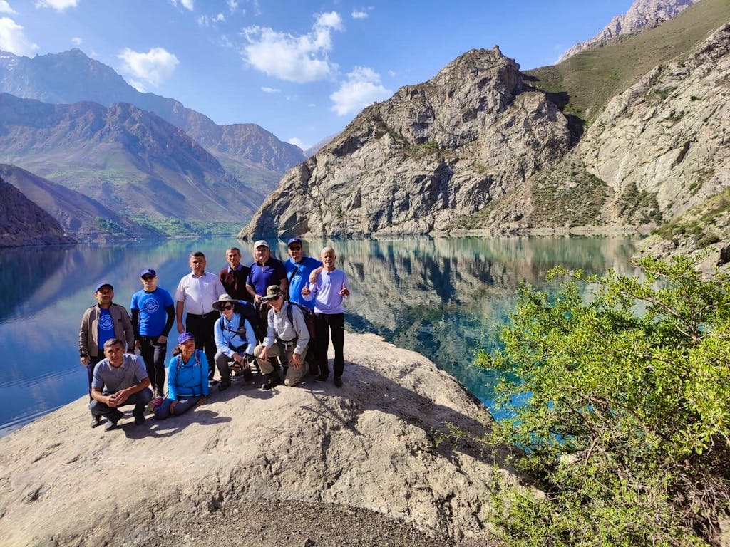 Group of hikers hiking the great Tajikistan Fann Mountains in Tajikistan