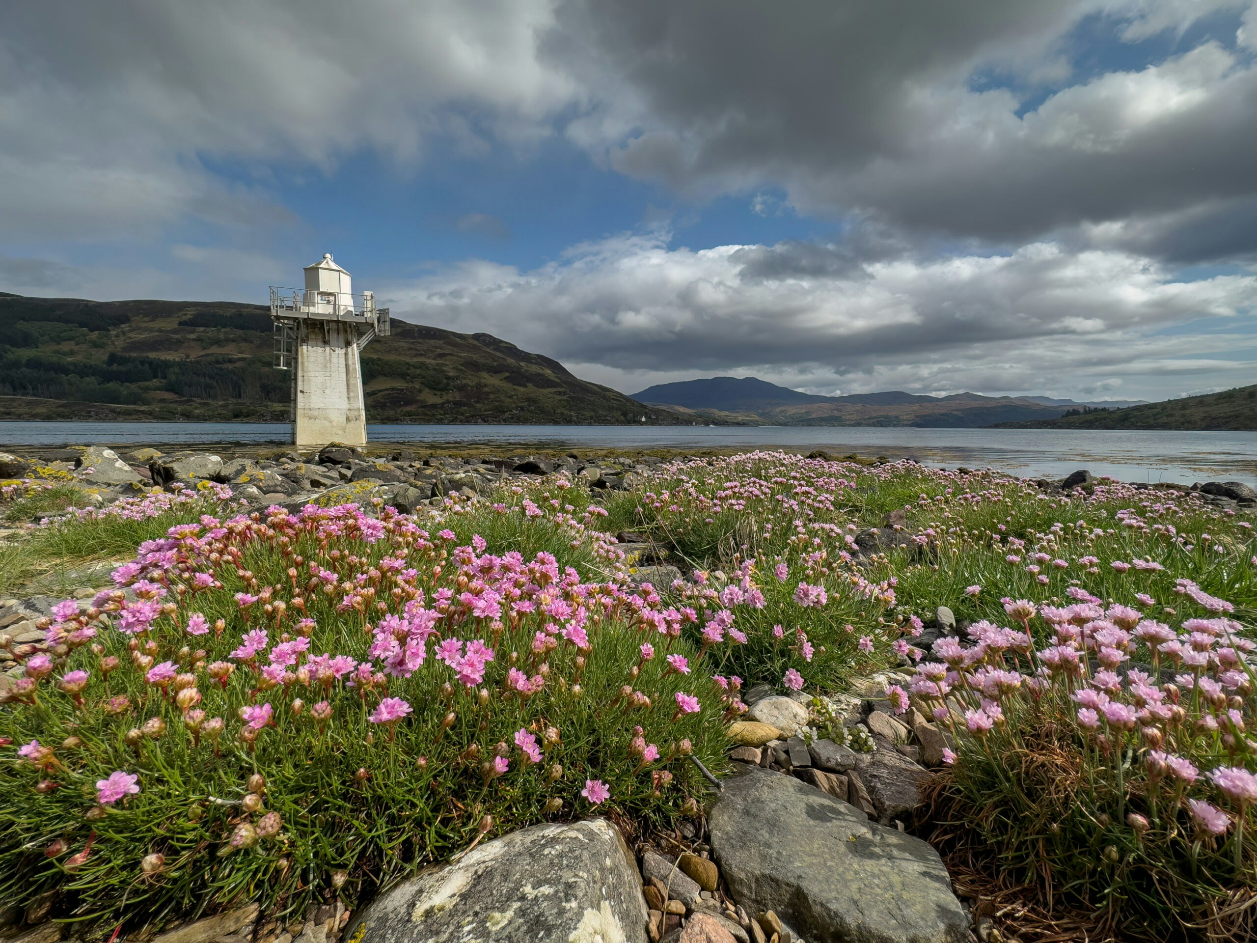 Tourists exploring the great Loch Lomond in a guided group in the Trossachs in Scotland, Europe