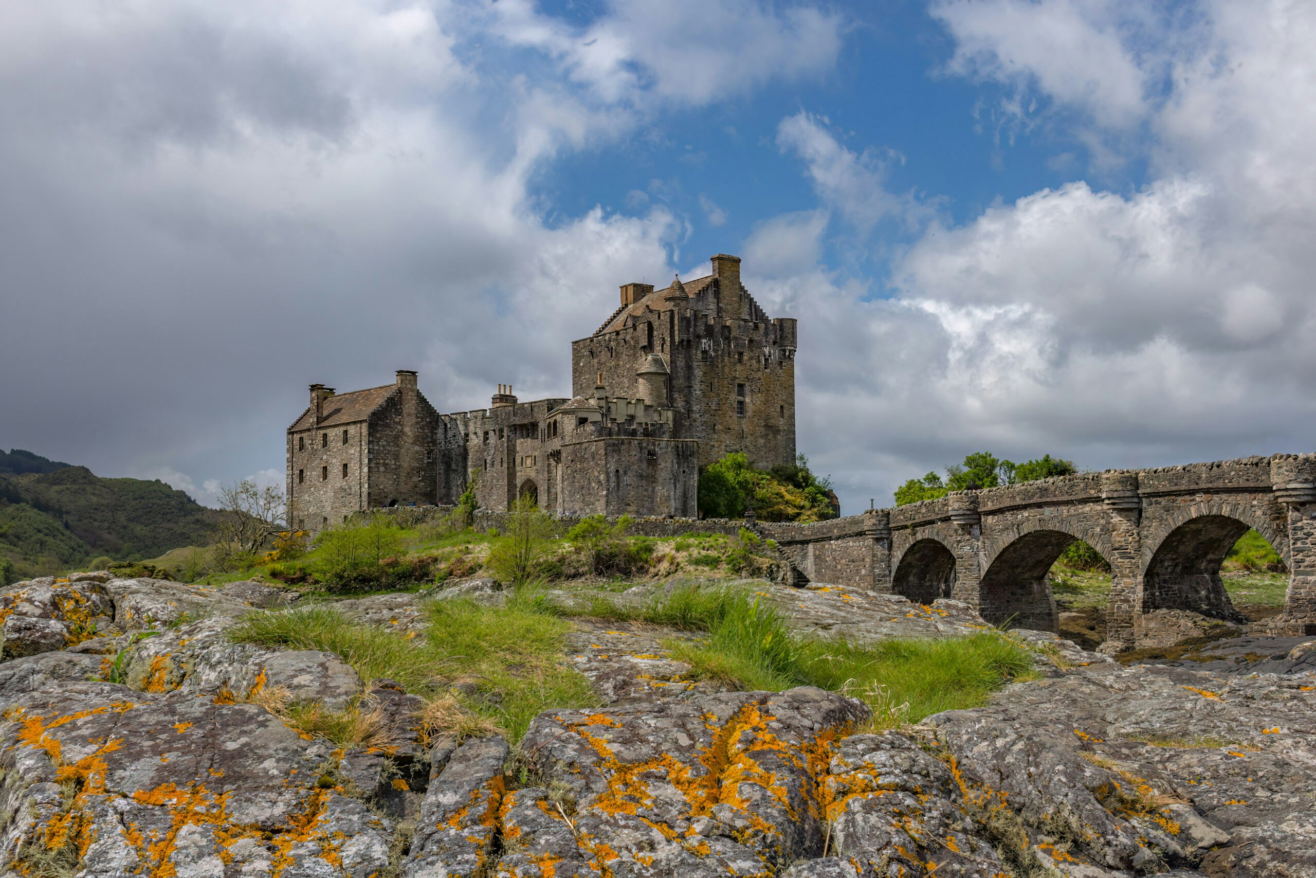 Tourists trekking Irverness' circular trail heading to Wester Ross in a Scotland hiking adventure