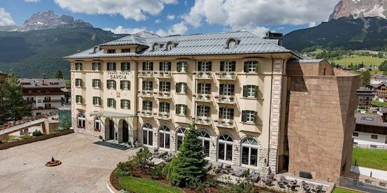 Enjoy an overnight stay at the local Grand Hotel Savoia in Cortina, a 5-star hotel in Italy, Europe during your Dolomites hiking adventure