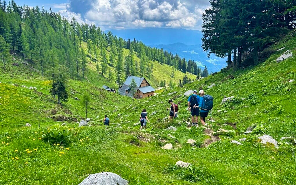 group of hikers trekking the scenic great Highlands in Slovenia, near Julian Alps, in Europe