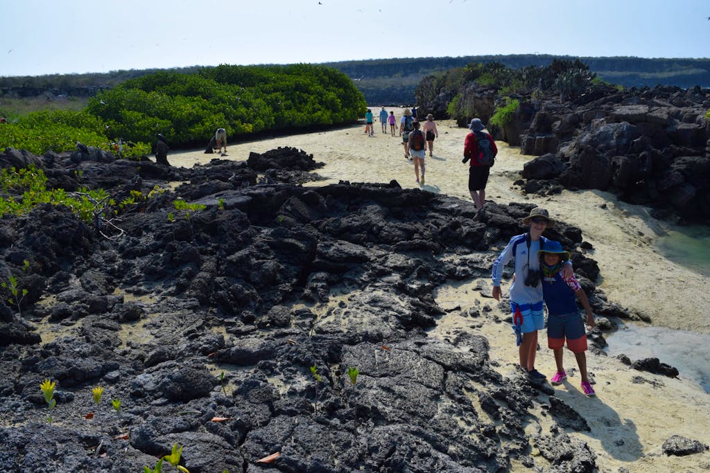 a girl and a guy exploring the Santa Cruz Island in the Galapagos scenery in Ecuador