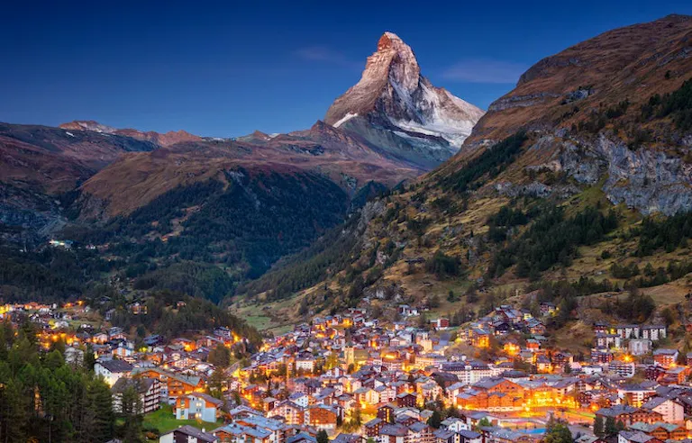 Zermatt, Switzerland at dusk with the matterhorn mountain in the background