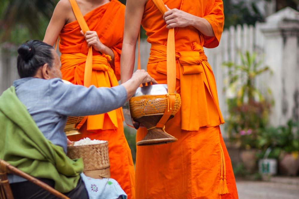 Traditional ritual of alms giving in Luang Prabang, Laos