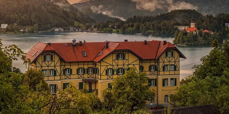 Stay overnight at the local Hotel Triglav near Lake Bled in Slovenia