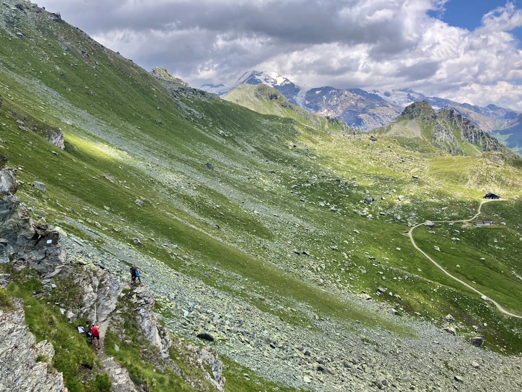 Hikers on a guided trek to Monte Rosa mountains in the Alps region near Italy in Europe